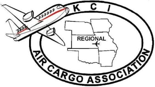 Logo featuring an airplane flying over a map in an oval frame. The map highlights several regional areas. The text "KCI Air Cargo Association" is written within the oval border, circling the map and airplane.