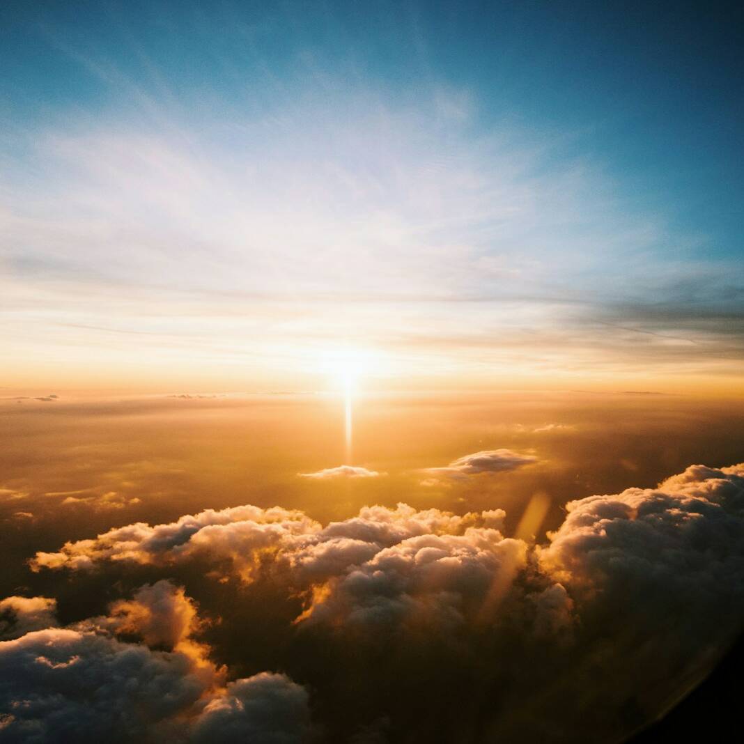 aerial view of sea of clouds during sunset